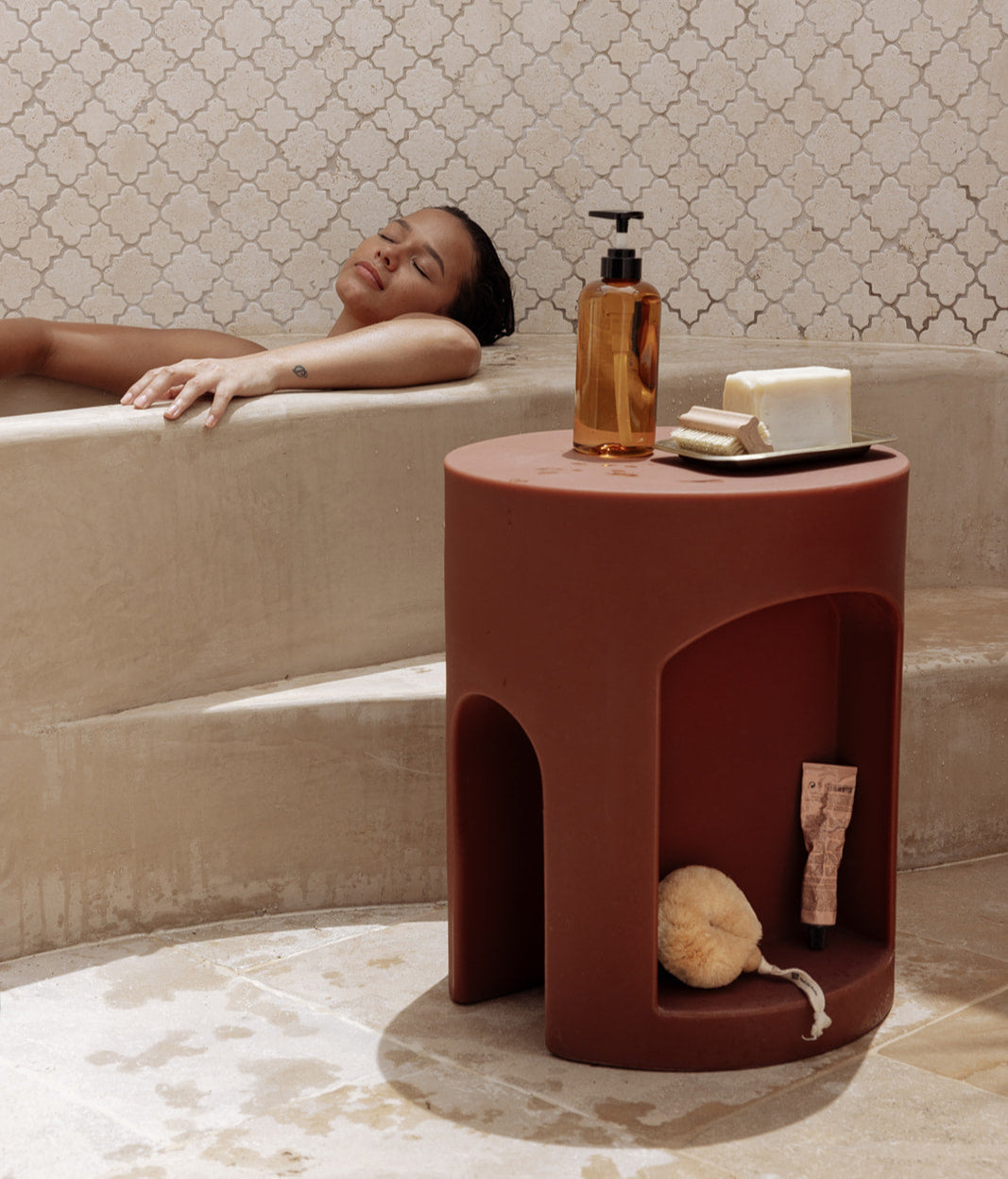 Relaxing in the bath, beauty products within reach on The Smallest Room Chapter One Shower Stool